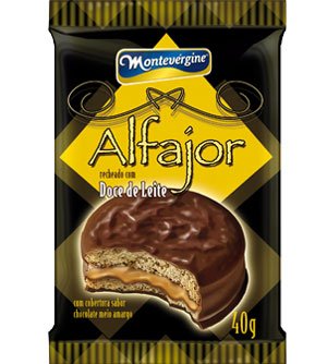 alfajor.jpg - ALFAJORDoce de leite, farinha de trigo enriquecida com ferro e ácido fólico, cobertura sabor chocolate meio amargo (açúcar, gordura vegetal, cacau em pó, óleo vegetal, emulsificantes lecitina de soja e polirricinoleato de poliglicerol e aromatizante idêntico ao natural), açúcar, amido de milho, margarina, xarope de glicose, ovo, água, cacau em pó, emulsificante lecitina de soja, fermentos químicos bicarbonato de sódio, e bicarbonato de amônio e aromatizantes idêntico ao natural e artificial de baunilha. Contém Glúten.
